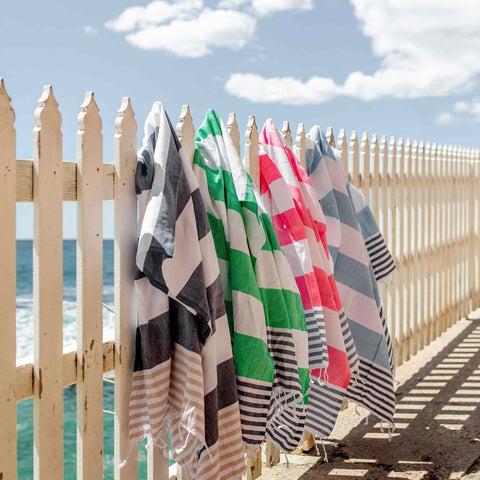 Girl lying on Colourful Turkish Beach Towel