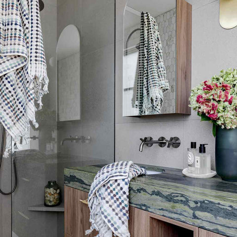 Eucalyptus Bathroom Set in white Turkish cotton with blue, grey and green woven diamond patterns and hand-tied tassels
