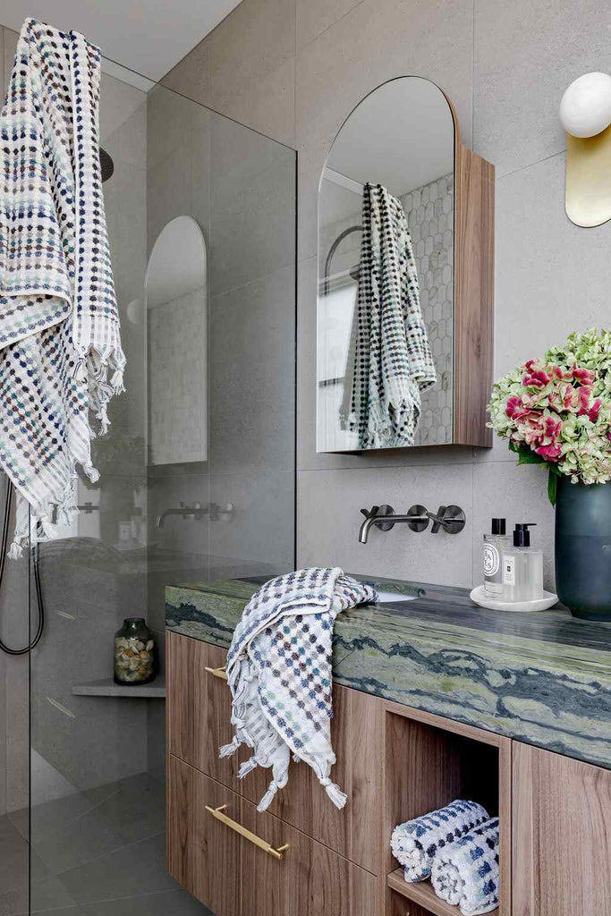 Eucalyptus Bathroom Set in white Turkish cotton with blue, grey and green woven diamond patterns and hand-tied tassels