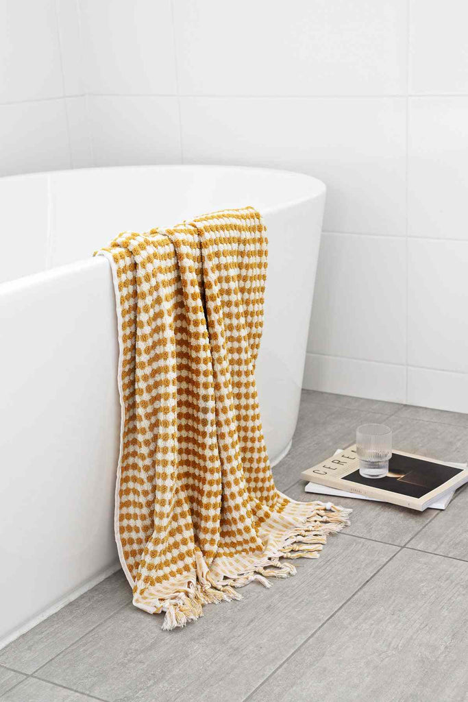 Mustard yellow Turkish cotton bathroom towel set with pompom tassels