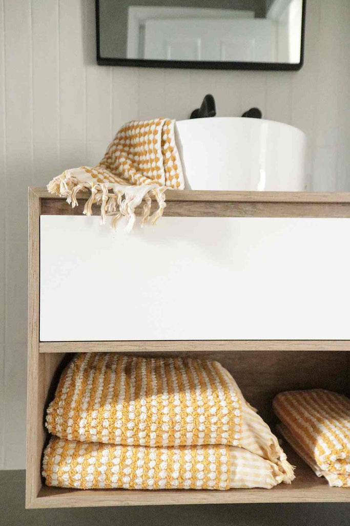 Mustard yellow Turkish cotton bathroom towel set with pompom details