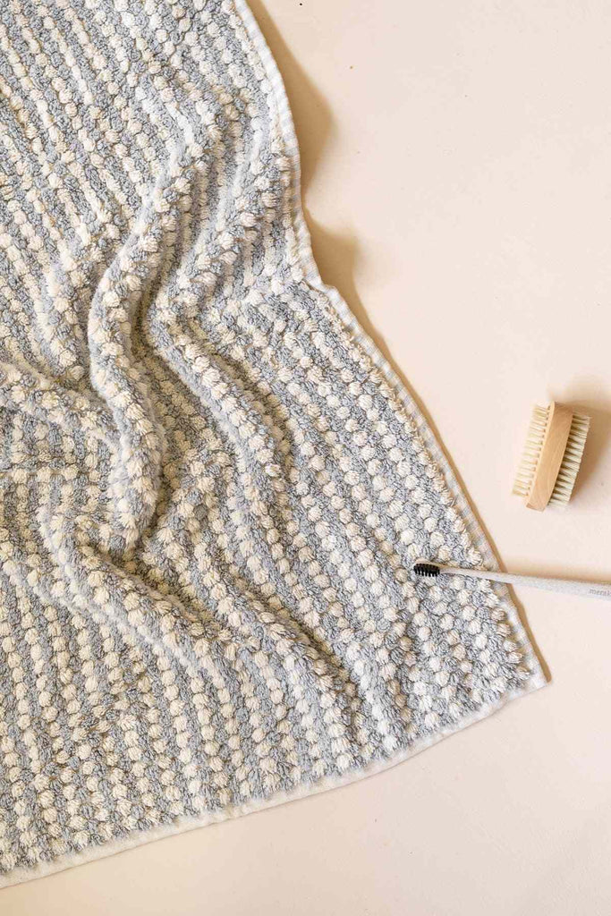 Soft pale grey Turkish cotton bathroom towel set with pompoms