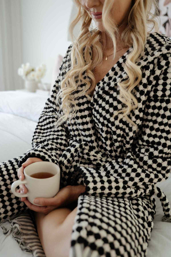Black and white pompom bath robe made of Turkish cotton with tassel details
