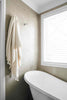 Natural beige Pompom Turkish cotton bath sheet towel draped