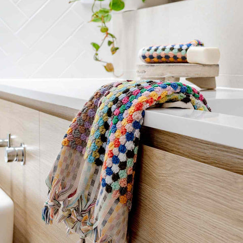 Colorful pompom Turkish cotton hand towel in candy hues