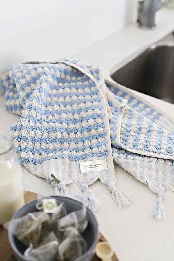 Pale blue Turkish cotton hand towel with white pompoms