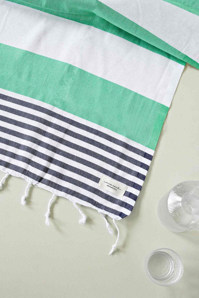 Apple green and navy striped Flamenco Turkish towel with fringe tassels