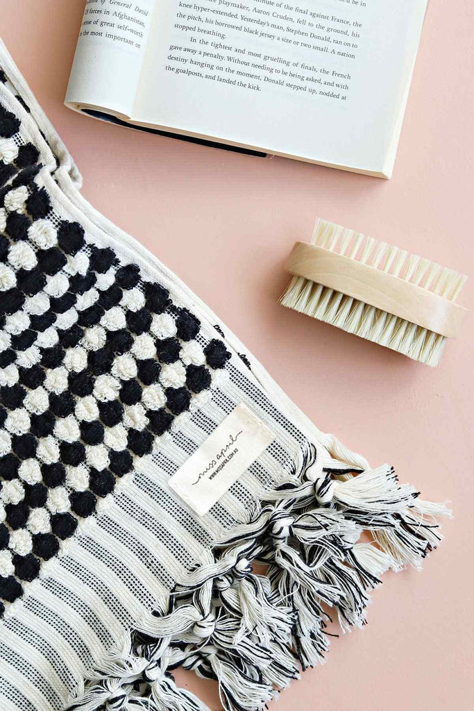 Pompom Turkish Cotton Bath Sheet - Black + White with tassels on pastel background