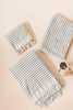 Pompom Turkish cotton bath sheet and smaller towels in pale grey with white stripes and tassels