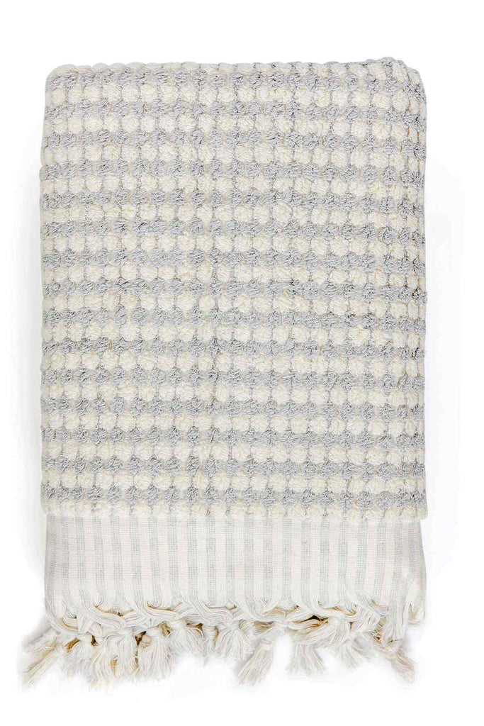 Pale grey pompom Turkish cotton bath sheet with textured pattern and fringed edges