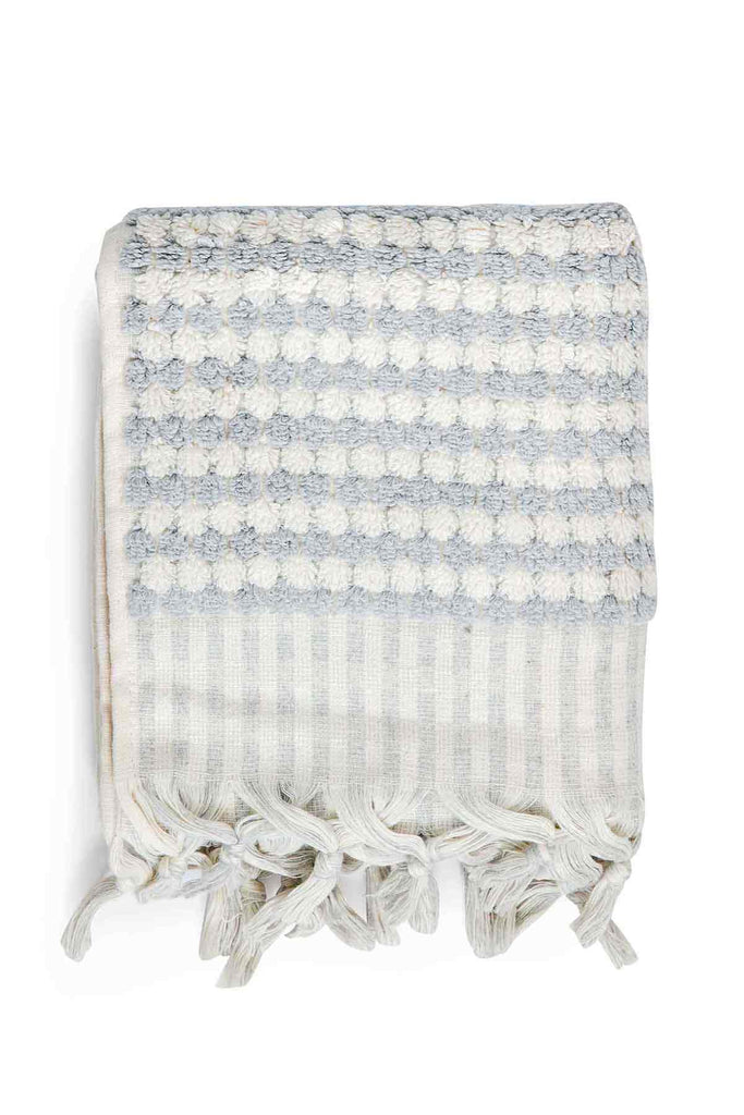 Pale grey pompom Turkish cotton hand towel with textured finish and fringes